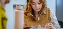 Picture of a student working on a tablet.