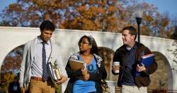 Students walking on campus in the fall.