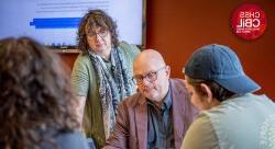 Photo of Professors Koen DePryk and Ilse Wambacq teaching a CBiL course