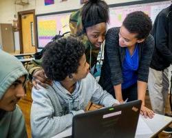 NMUTR teacher helping students