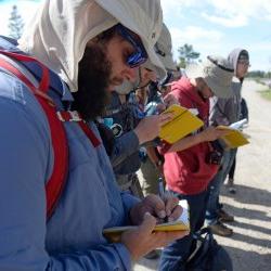 students taking notes on hike