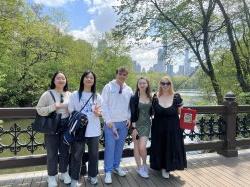 Group of Spring 2024 students in Central Park on Bridge in front of water