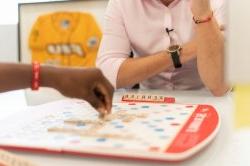 Two people playing scrabble