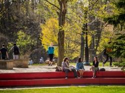 Students sitting on a ledge.