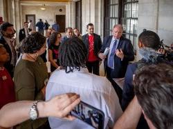 A state senator talks to a group of students, faculty and staff.