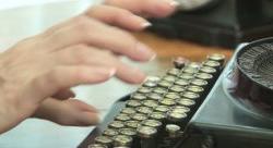 Photograph of hands typing