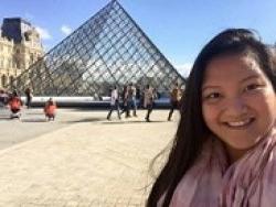 Study abroad peer advisor Thao Nguyen smiling.