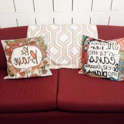 A couch in the Women's Center with pillows.